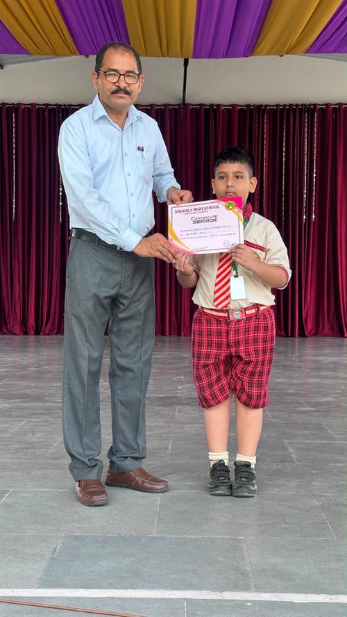 A young student receiving a certificate