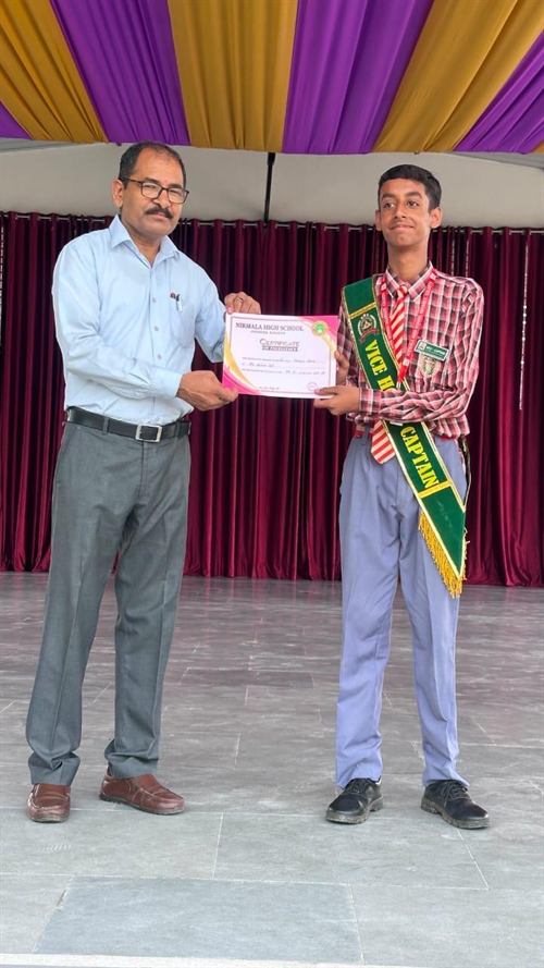 A student receiving an academic achievement certificate
