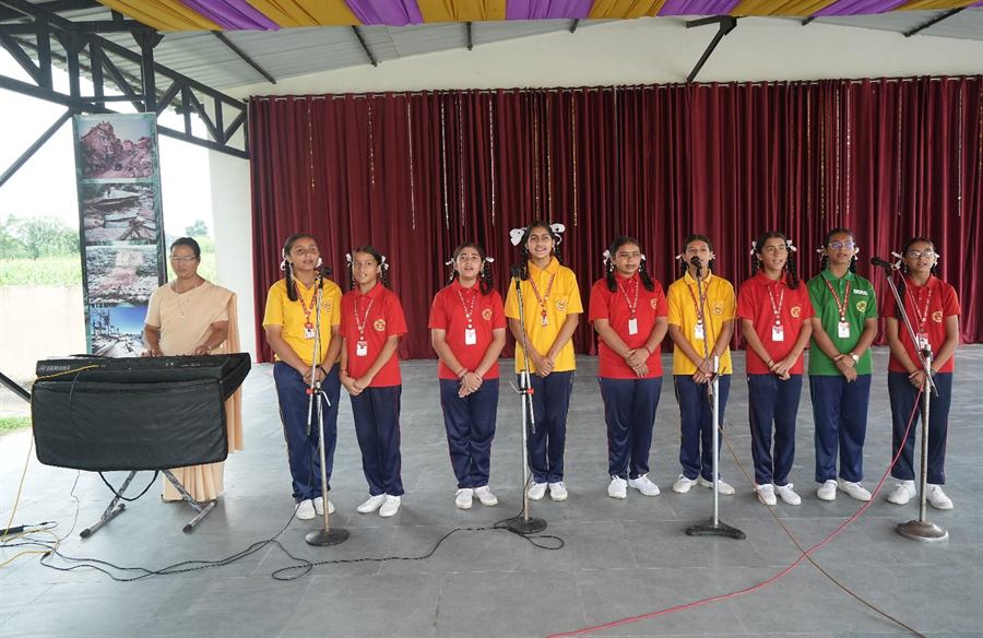 Students singing on stage
