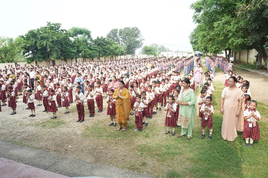 Students at morning assembly on the school ground