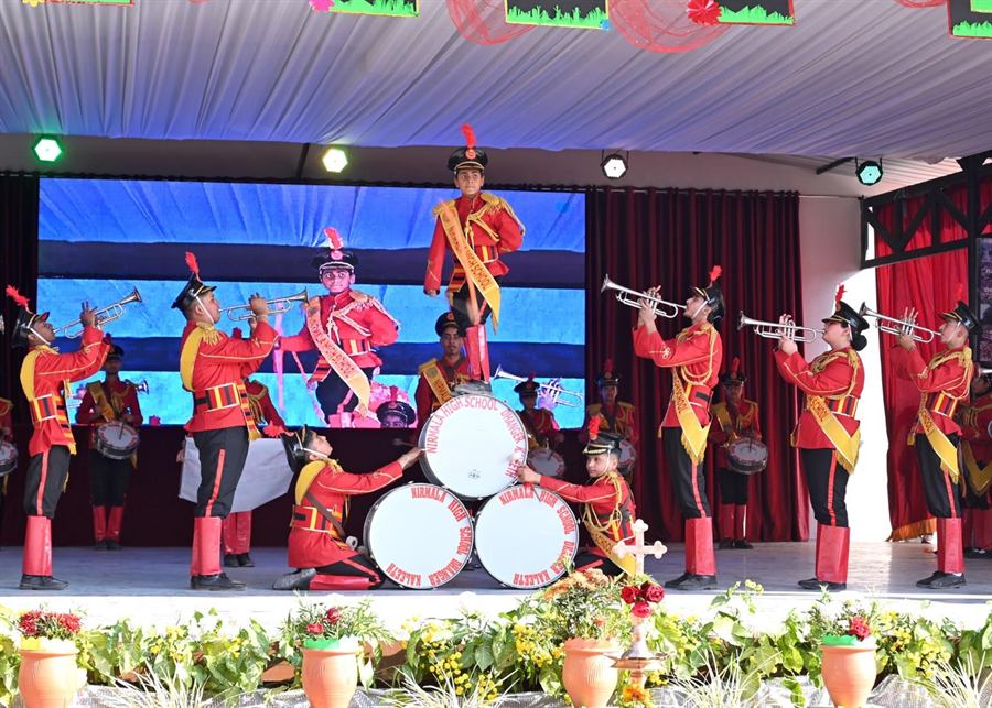 The school band performing on stage at the Annual Day