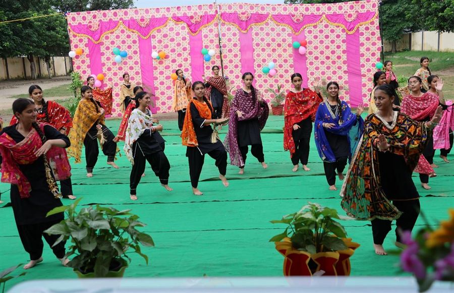 Teachers dancing at a school celebration